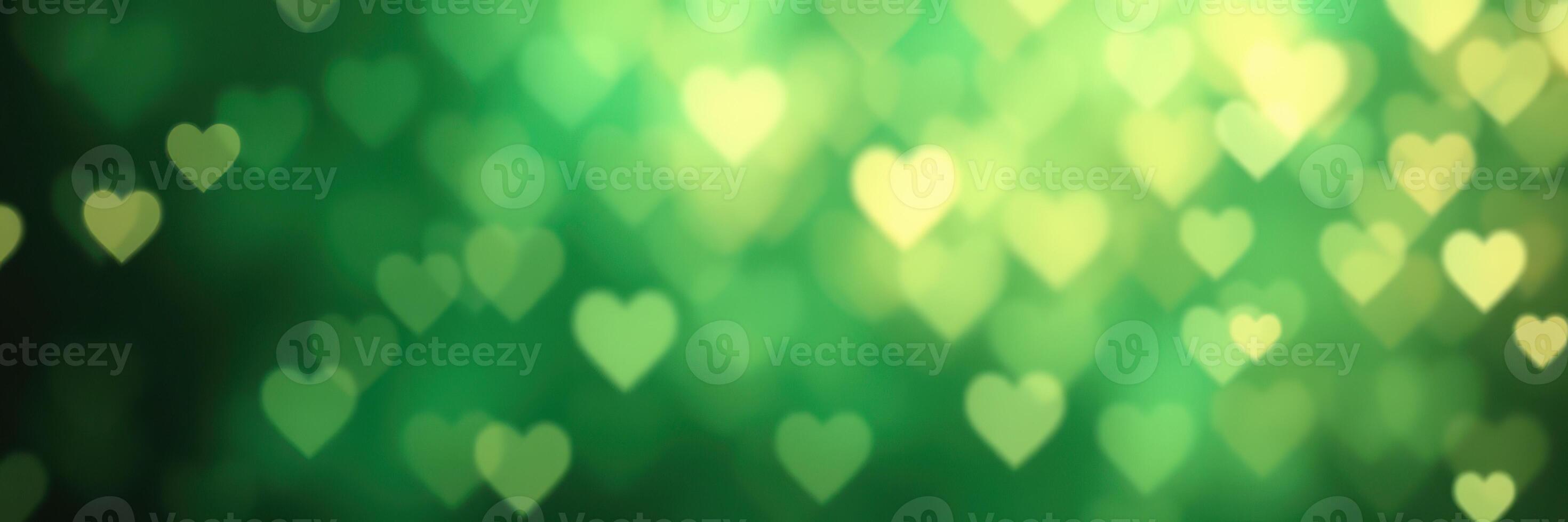 Sparkling heart shapes create a dreamy green background for romantic or festive occasions photo