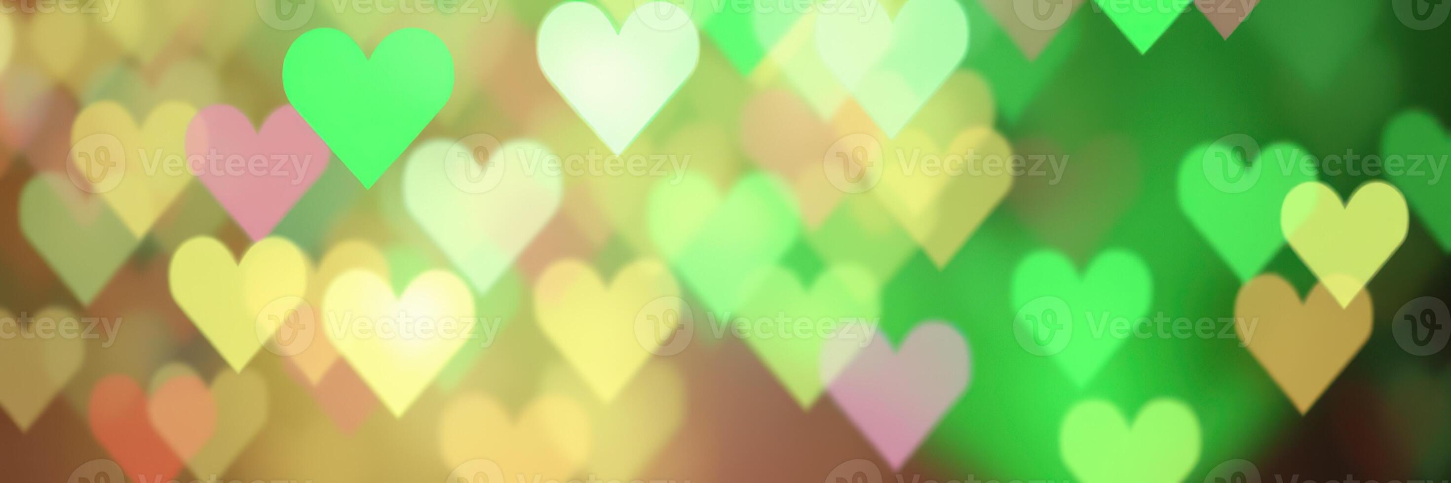 Colorful hearts in various shades create a cheerful and lively background suitable for celebrations or romantic events photo