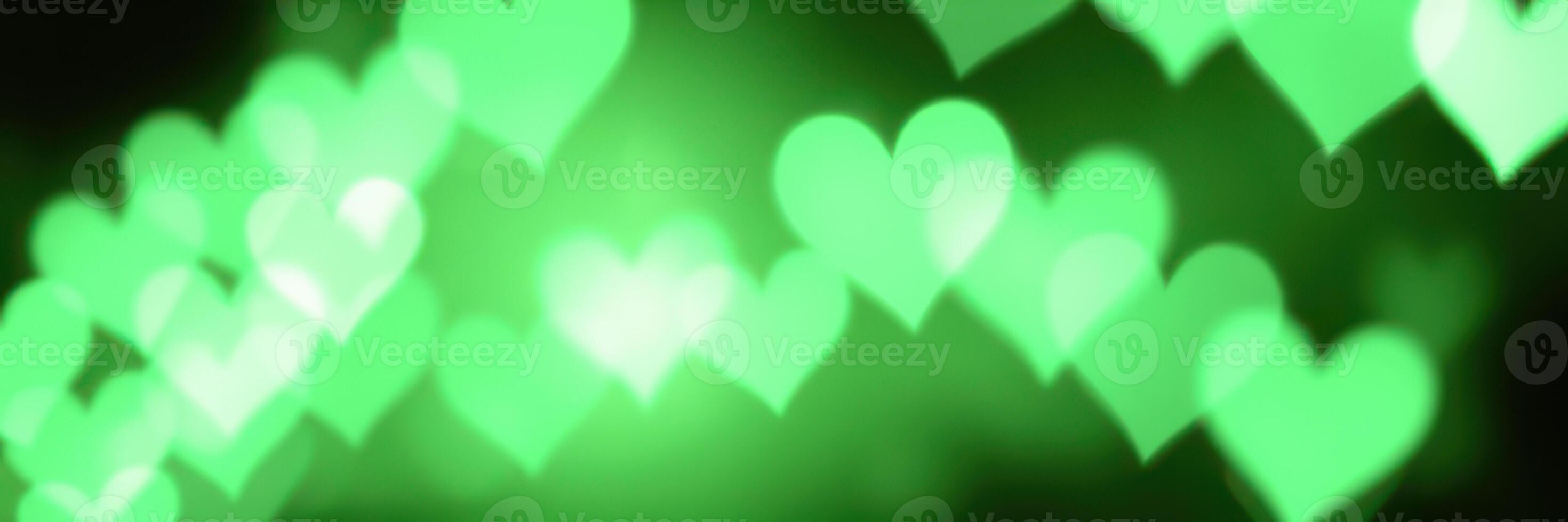 Colorful green heart shapes create a vibrant atmosphere for celebrations and events at night photo