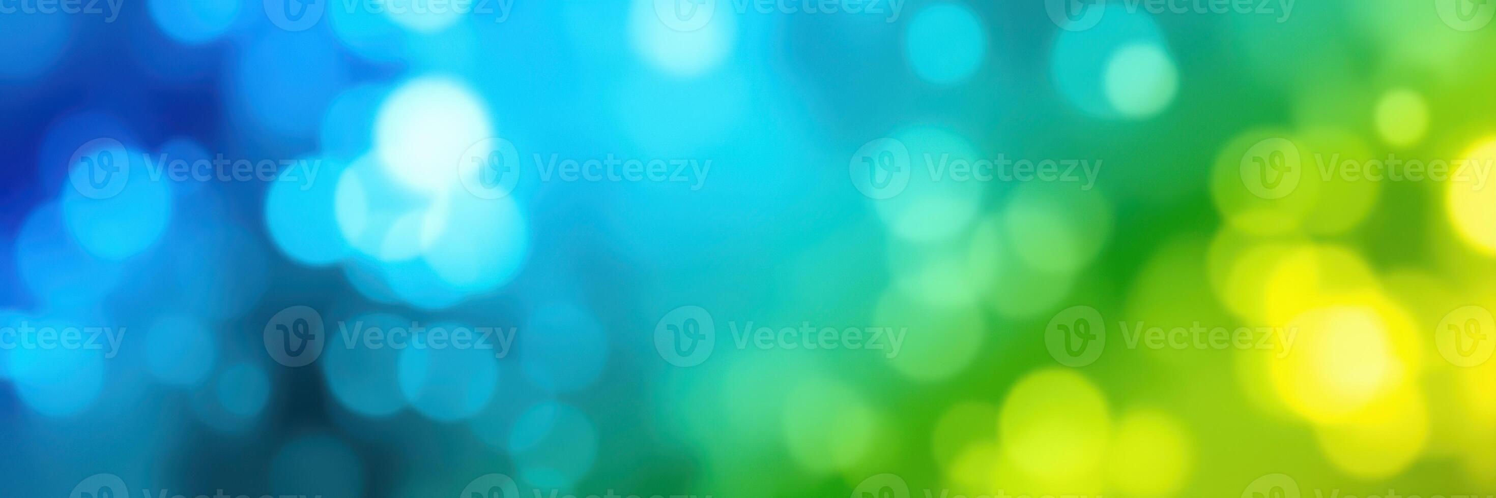 Vibrant bokeh pattern creates a mesmerizing background with blue, green, and yellow hues for artistic design photo