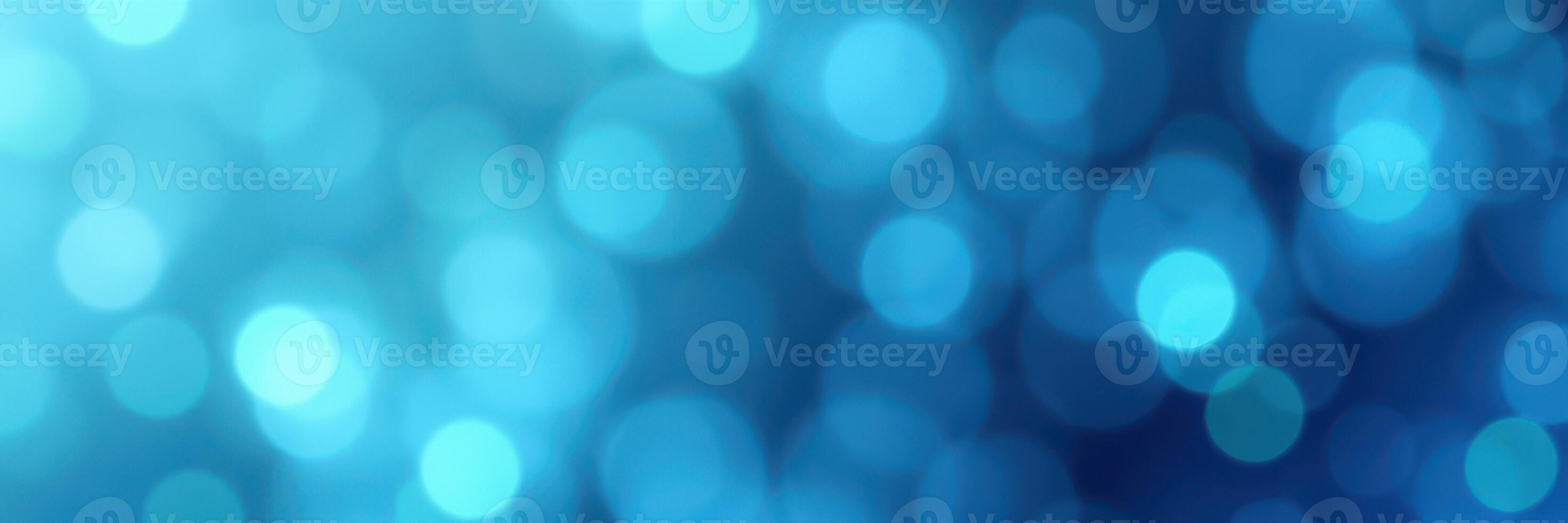 Abstract blue bokeh background created by soft and blurred light effects in a serene atmosphere photo