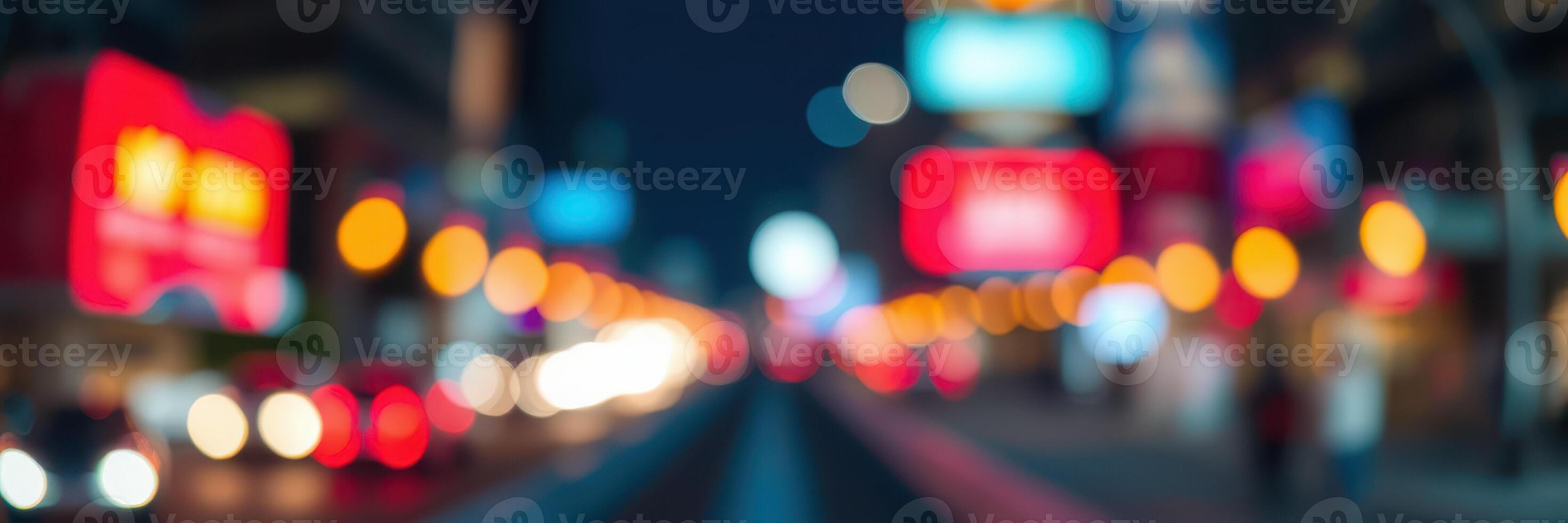 Nightlife in the city with blurred lights creating a vibrant atmosphere and a sense of motion along a busy street photo