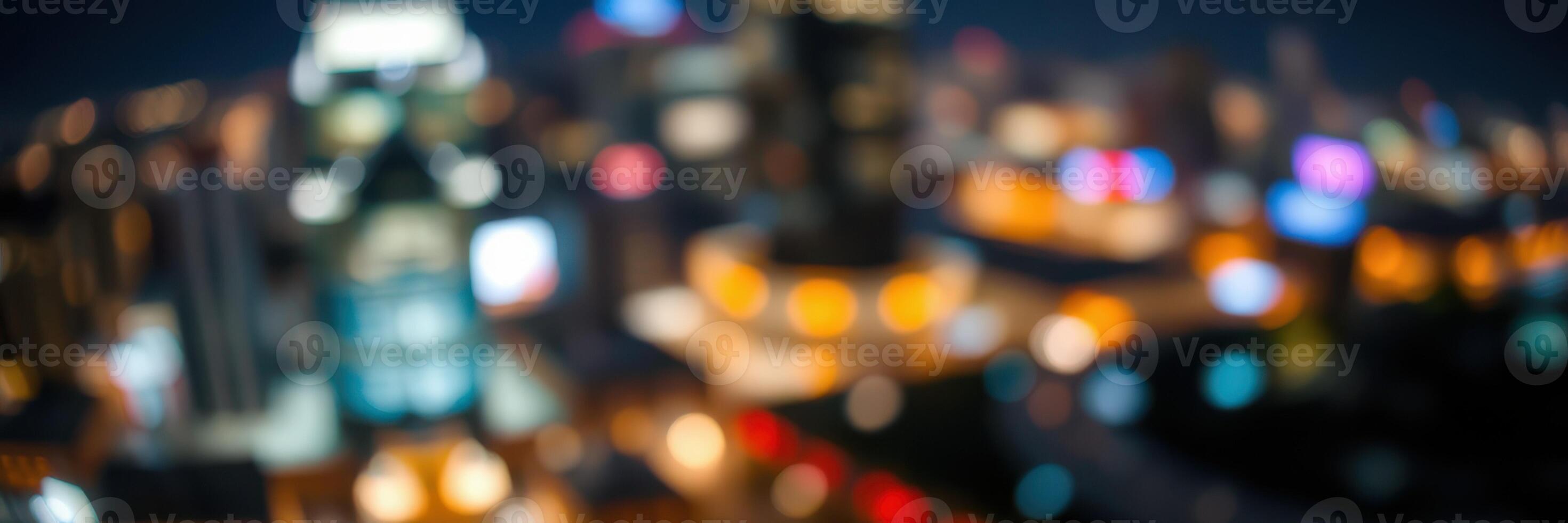 Nighttime city skyline is illuminated with vibrant lights and blurred urban atmosphere creating an energetic backdrop photo