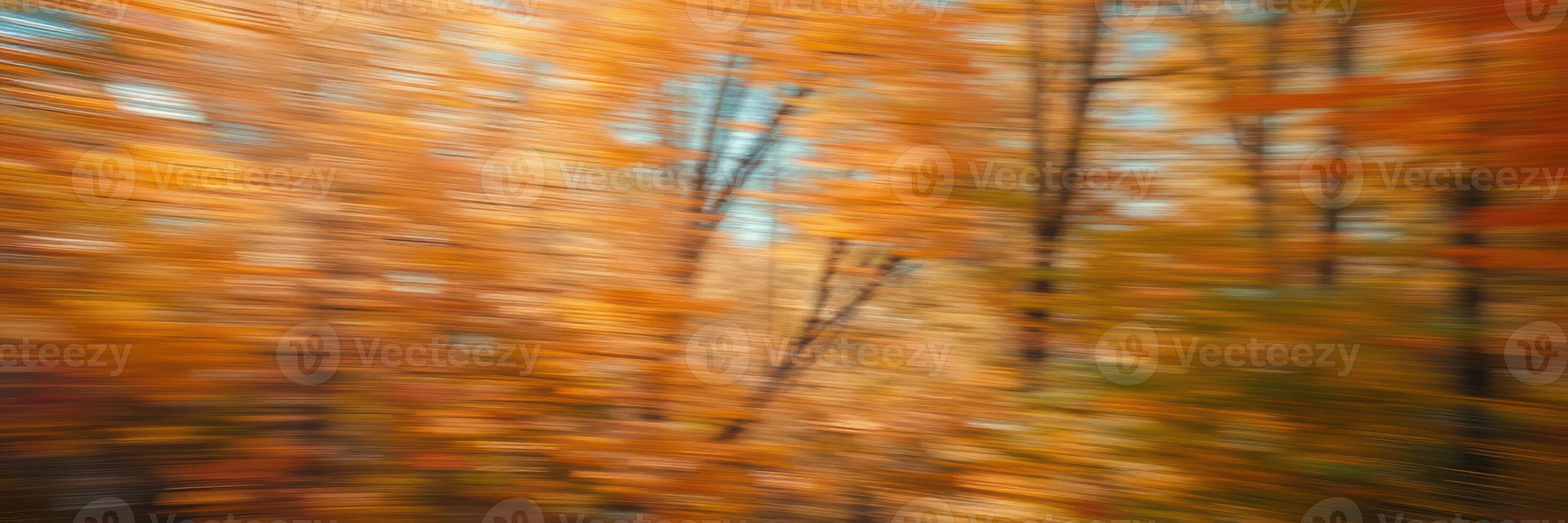 Vibrant autumn foliage creates a colorful backdrop in a blurred forest landscape during fall season photo