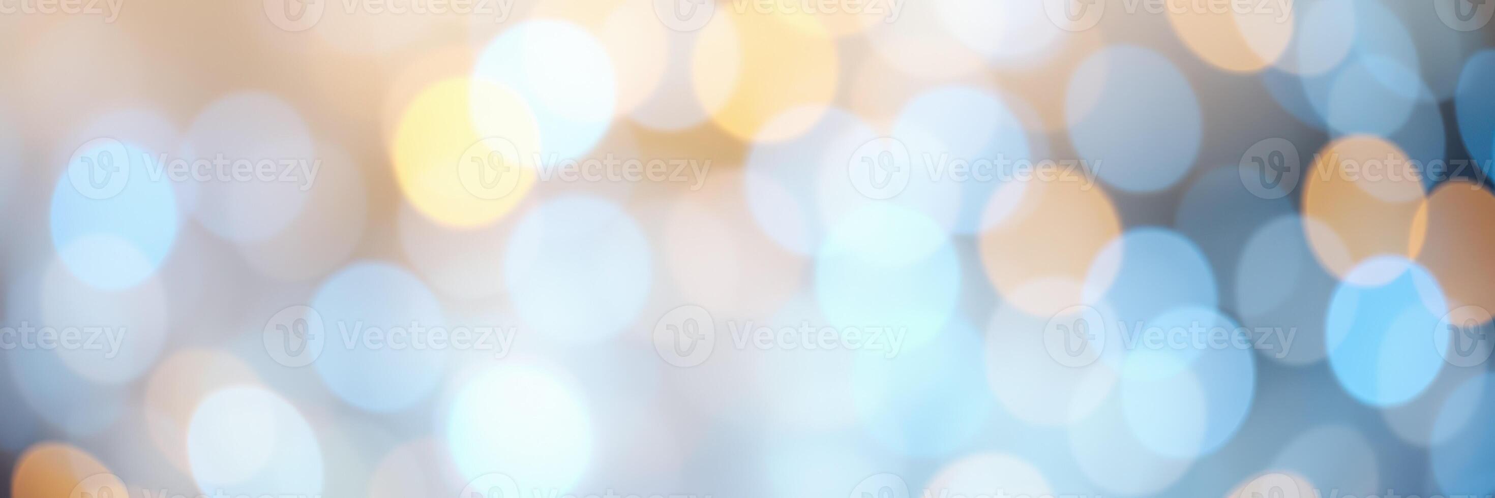 Soft, blurred lights create a dreamy background with a combination of blue and orange colors for festive occasions photo