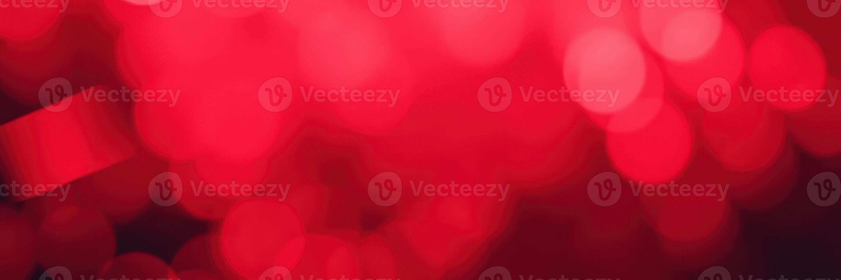 Colorful abstract background with varying shades of red and light bokeh effects during a festive evening event in a vibrant city atmosphere photo