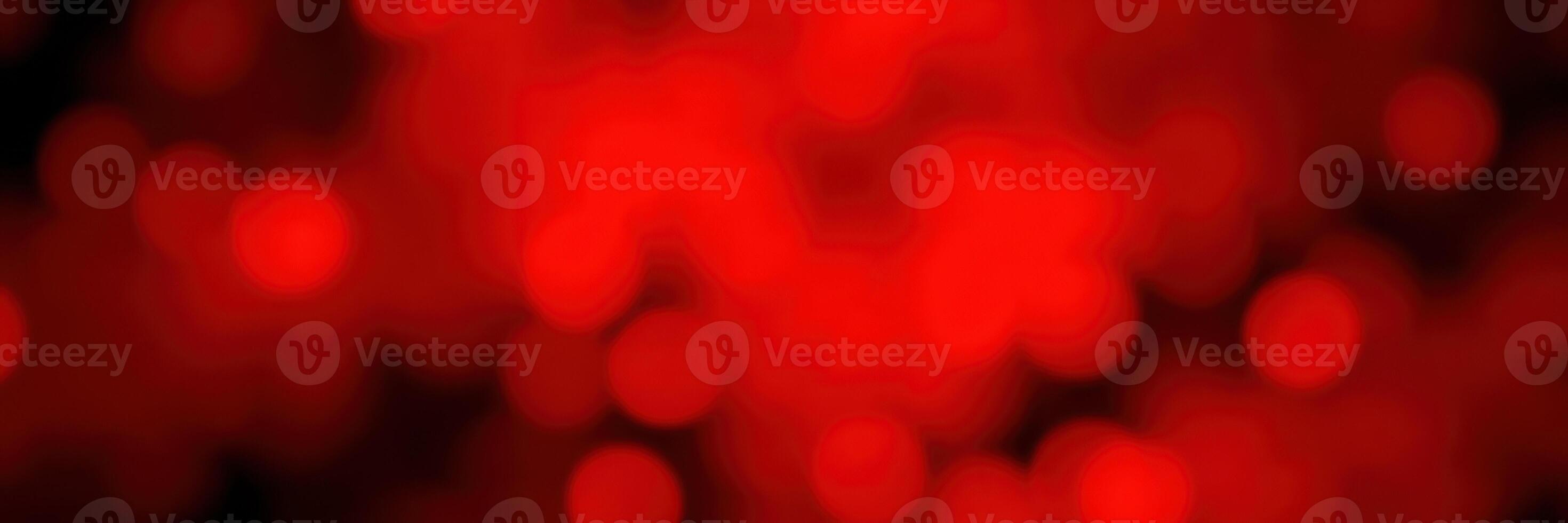 Vibrant red bokeh lights create a warm and festive atmosphere during an evening celebration or event photo