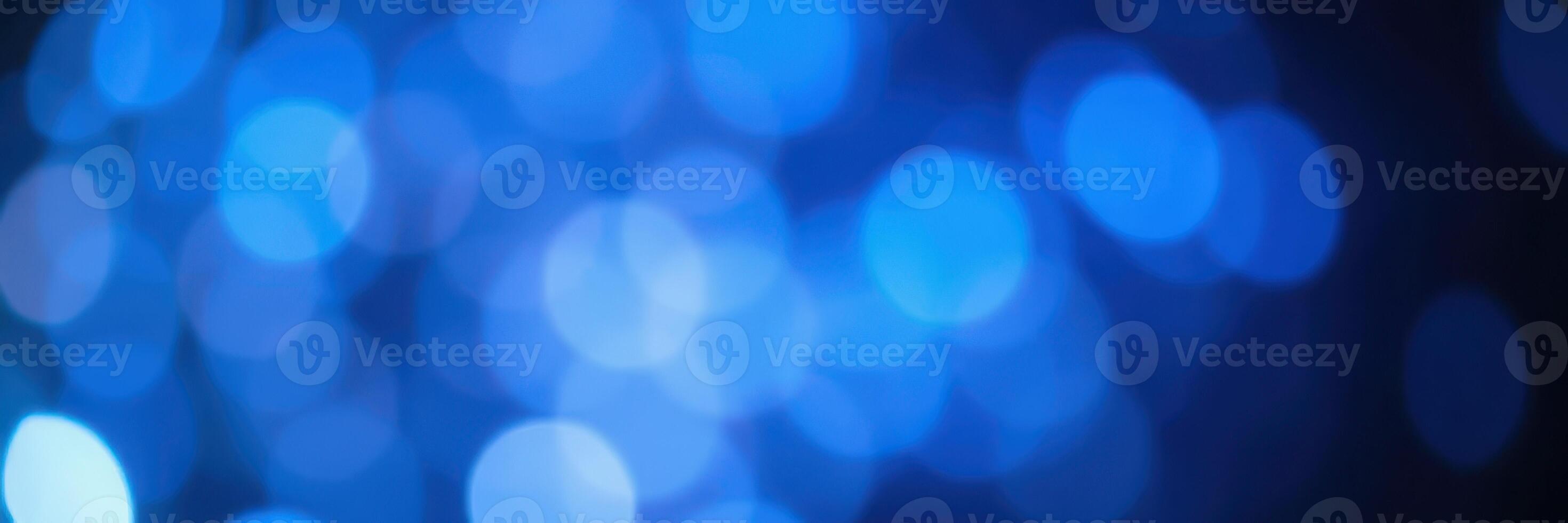 Soft blue bokeh lights create a calming atmosphere for nighttime gatherings and celebrations photo