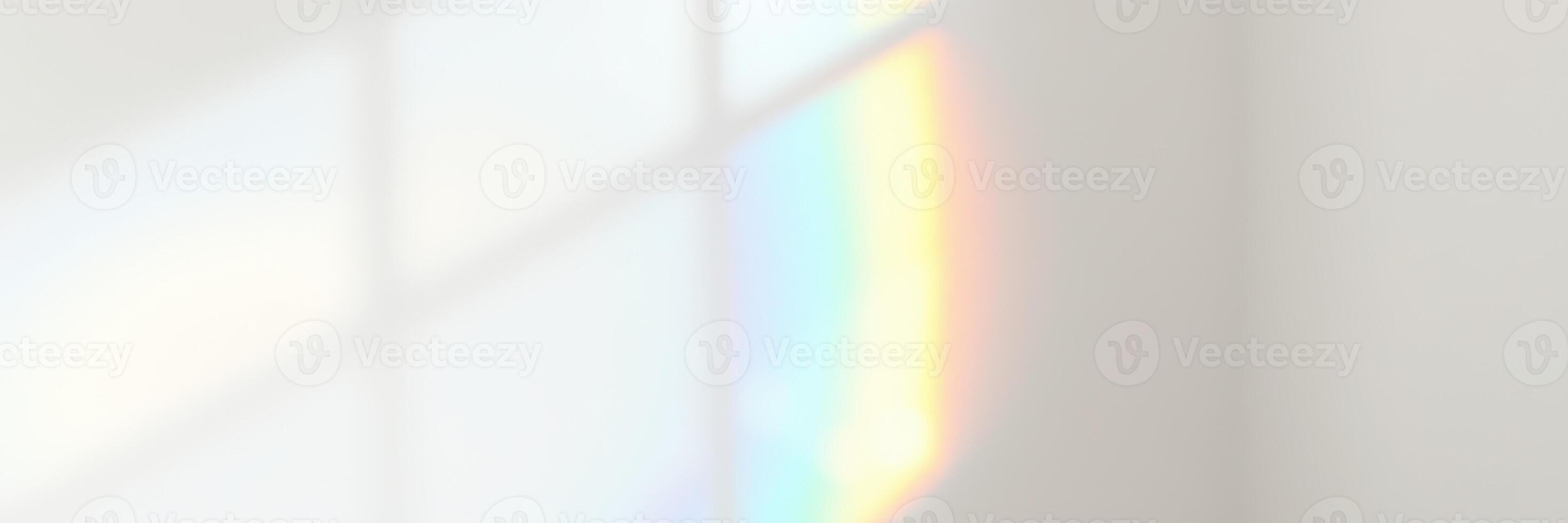 Colorful reflections on a white wall create a tranquil atmosphere in a sunlit room during the afternoon photo