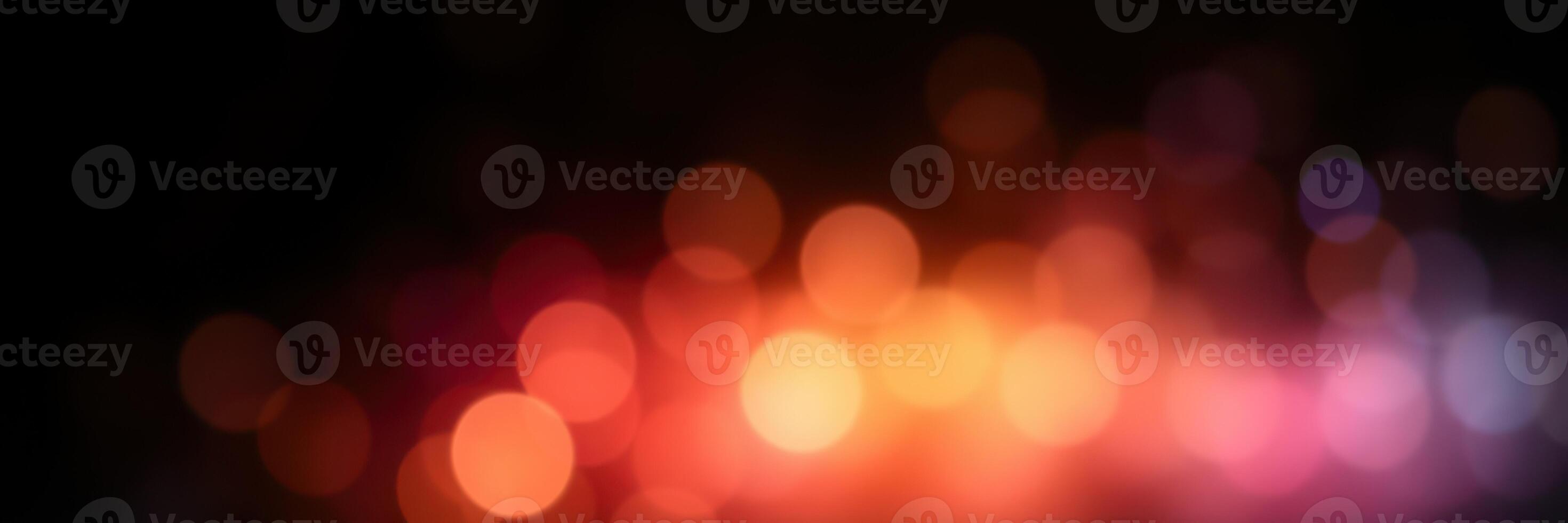 Colorful bokeh lights create a warm ambiance in a dark setting during a festive evening celebration photo