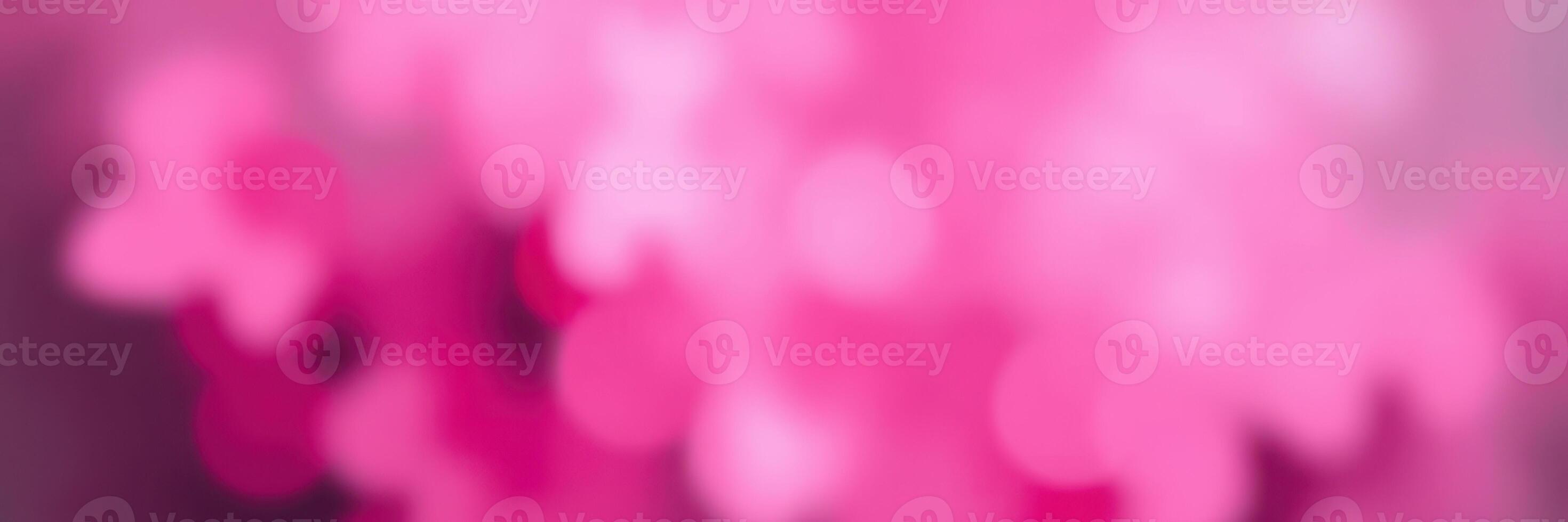 Soft pink bokeh lights create a dreamy atmosphere at an outdoor evening gathering in a garden photo