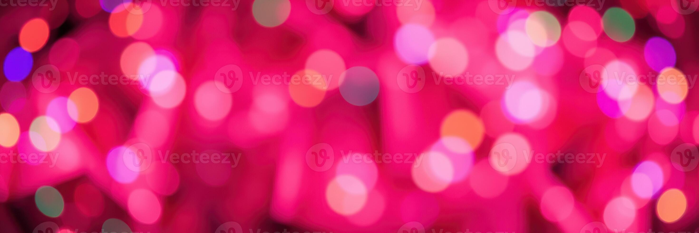 Colorful bokeh lights create a vibrant atmosphere during a festive evening celebration in a city photo