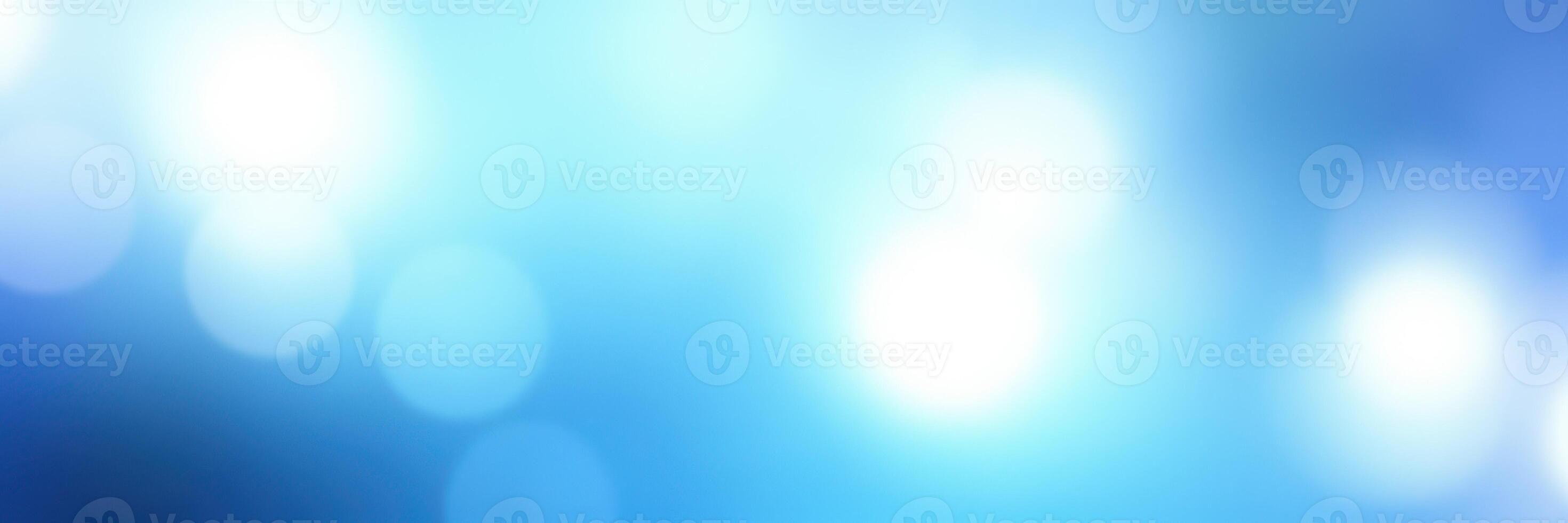 Soft blue abstract background with light bokeh effects creating a dreamy atmosphere photo