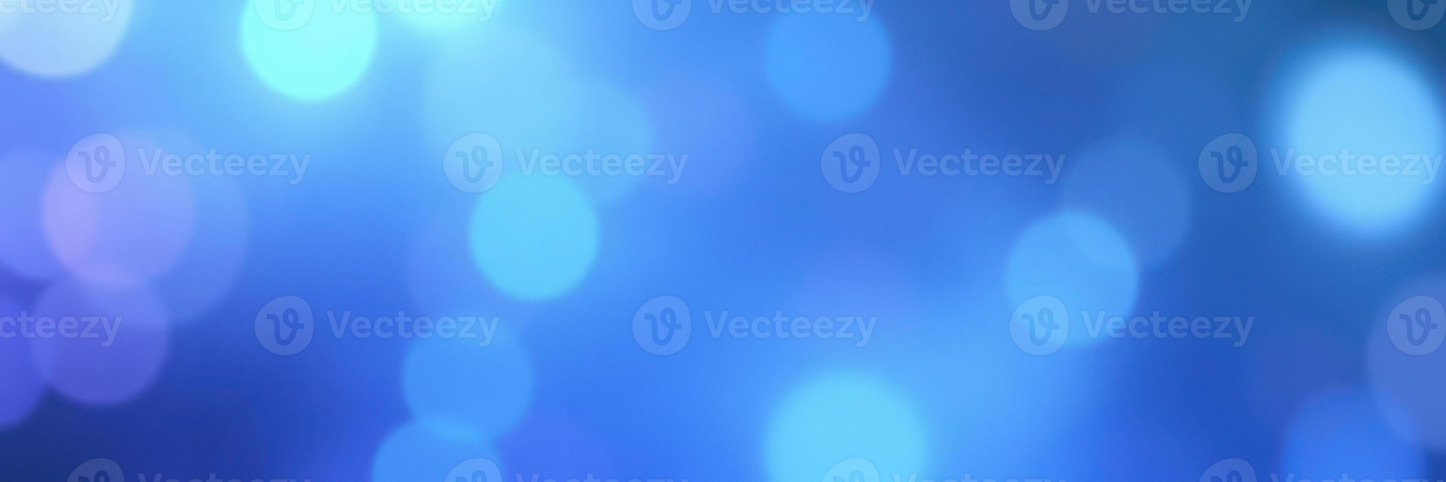 Vibrant blue bokeh lights create a dreamy atmosphere for a festive celebration or event photo
