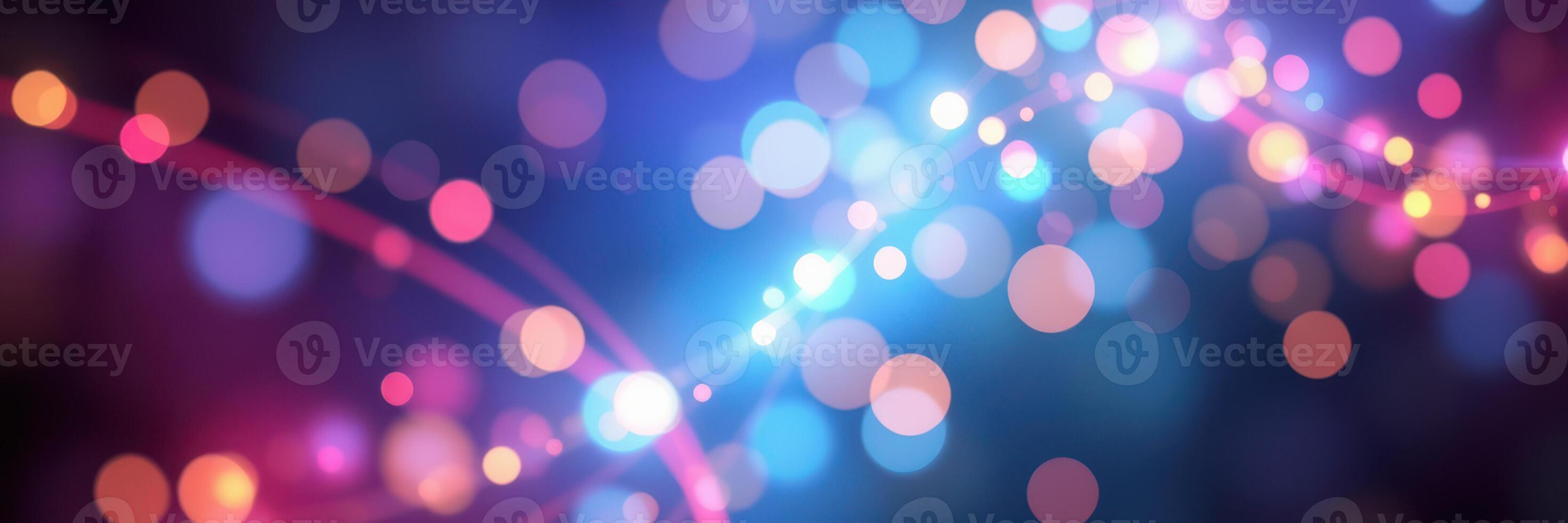 Colorful bokeh lights create a magical atmosphere during a festive evening gathering in a vibrant urban setting photo