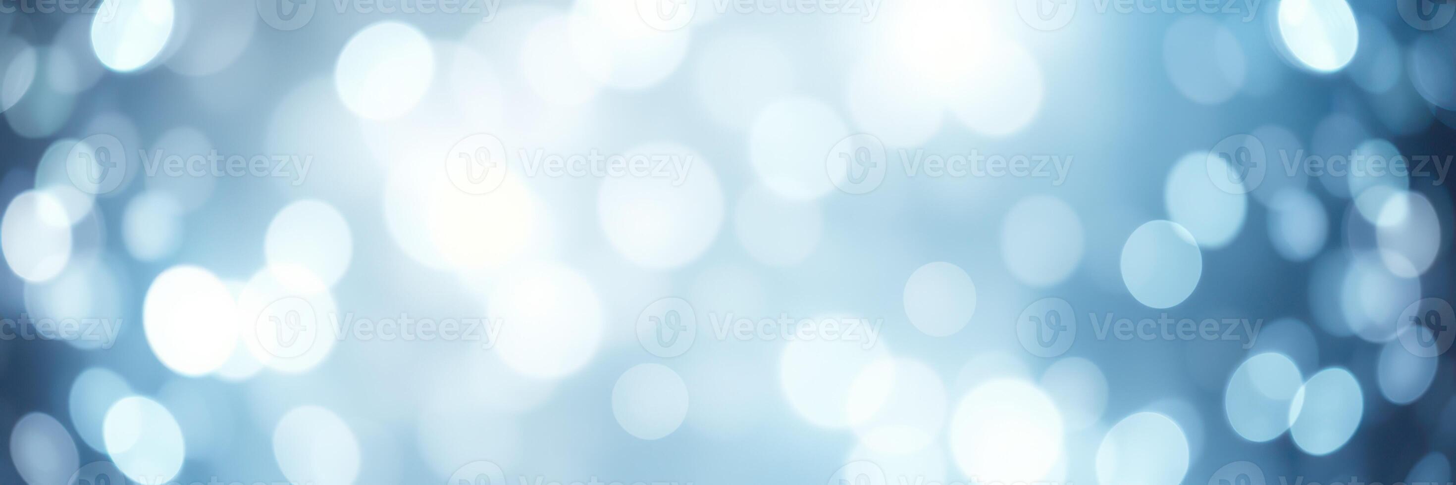 Soft blue bokeh with glowing lights creates a serene and dreamy atmosphere perfect for artistic backgrounds photo