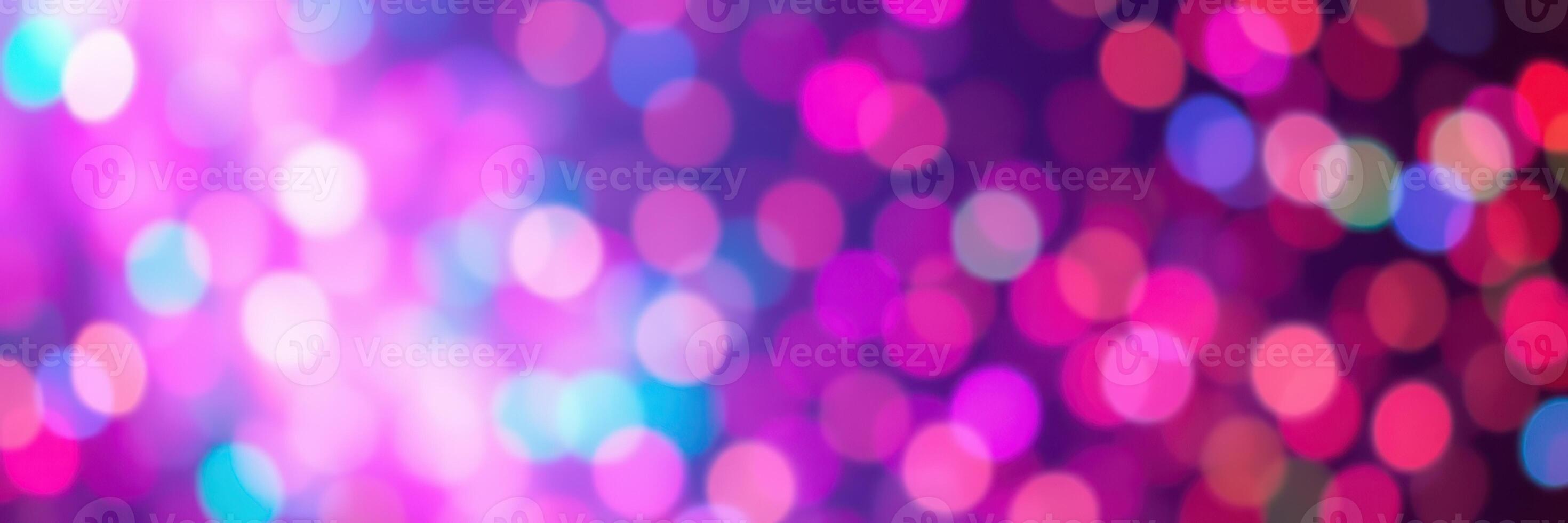 Colorful abstract bokeh lights create a vibrant atmosphere at an evening celebration in a festive setting photo