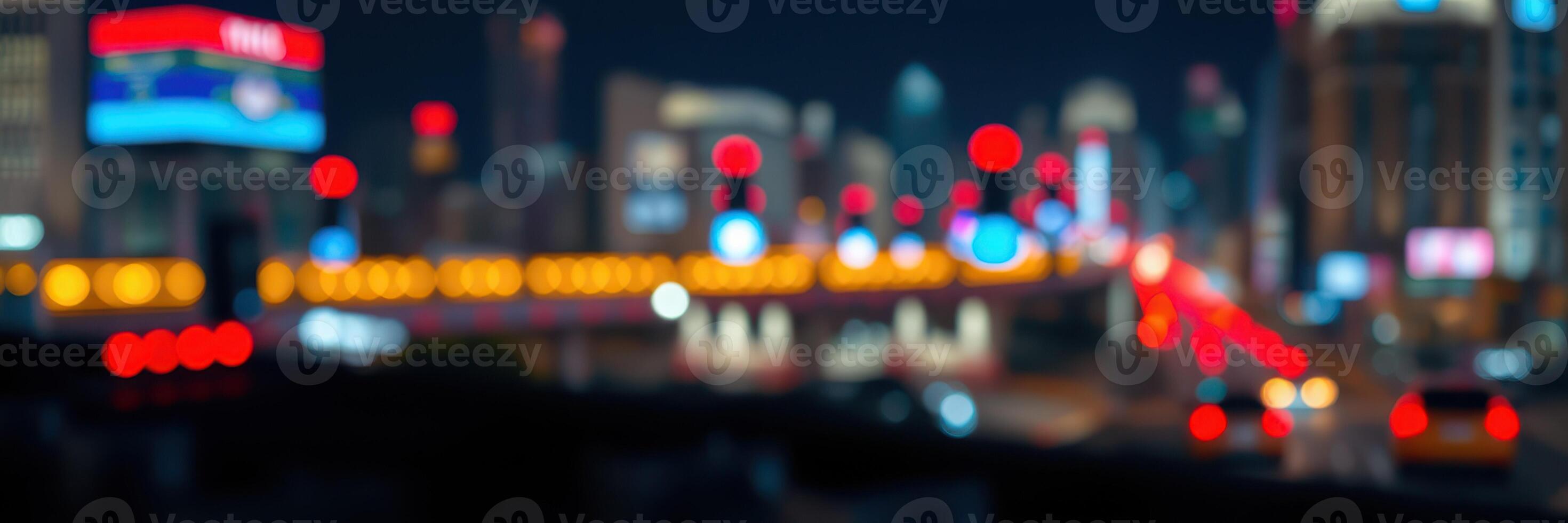 Nighttime cityscape illuminated by colorful neon lights with blurred traffic in motion photo