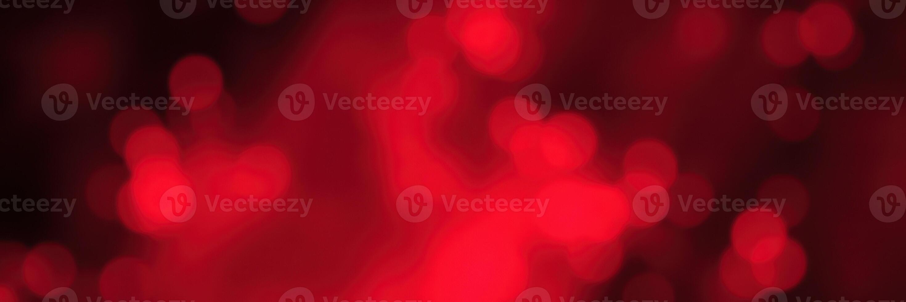 Vibrant red bokeh lights create a festive atmosphere during a celebration at night in an urban setting photo