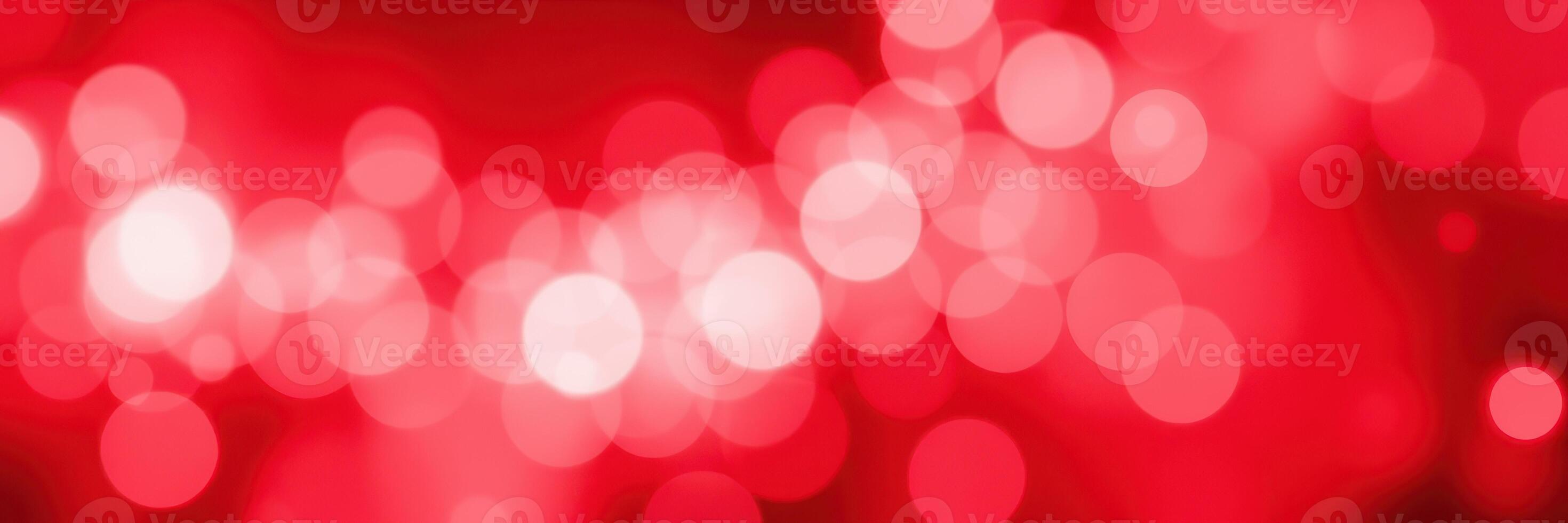 Red bokeh lights create a vibrant and festive atmosphere during an evening celebration photo