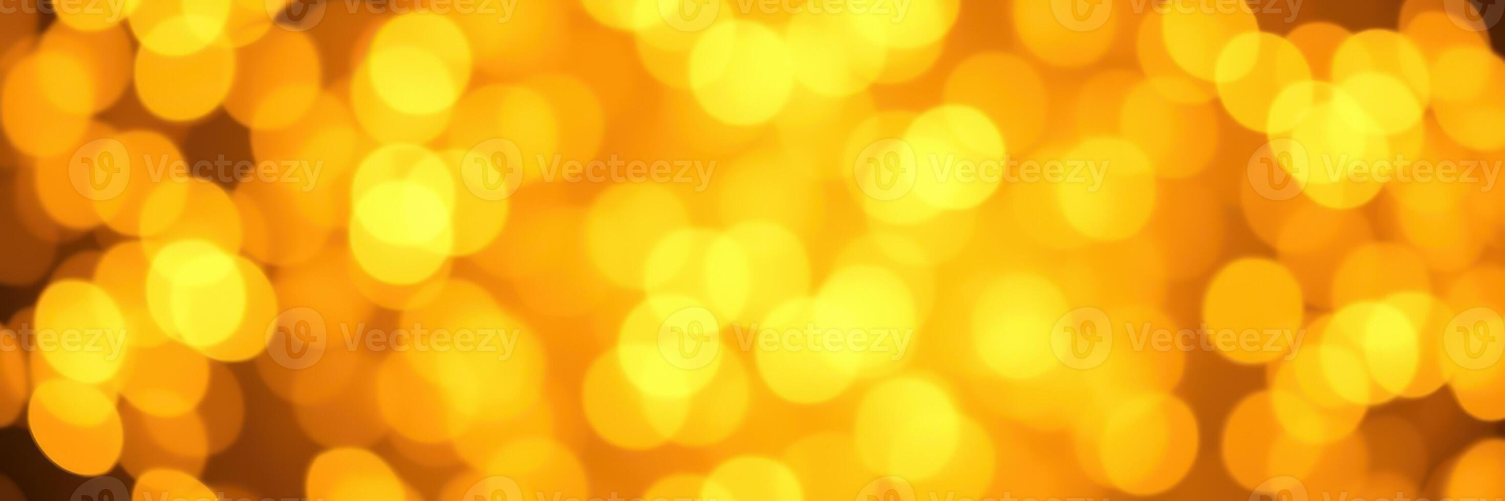 Bright golden bokeh lights create a warm and festive atmosphere in a celebration setting photo
