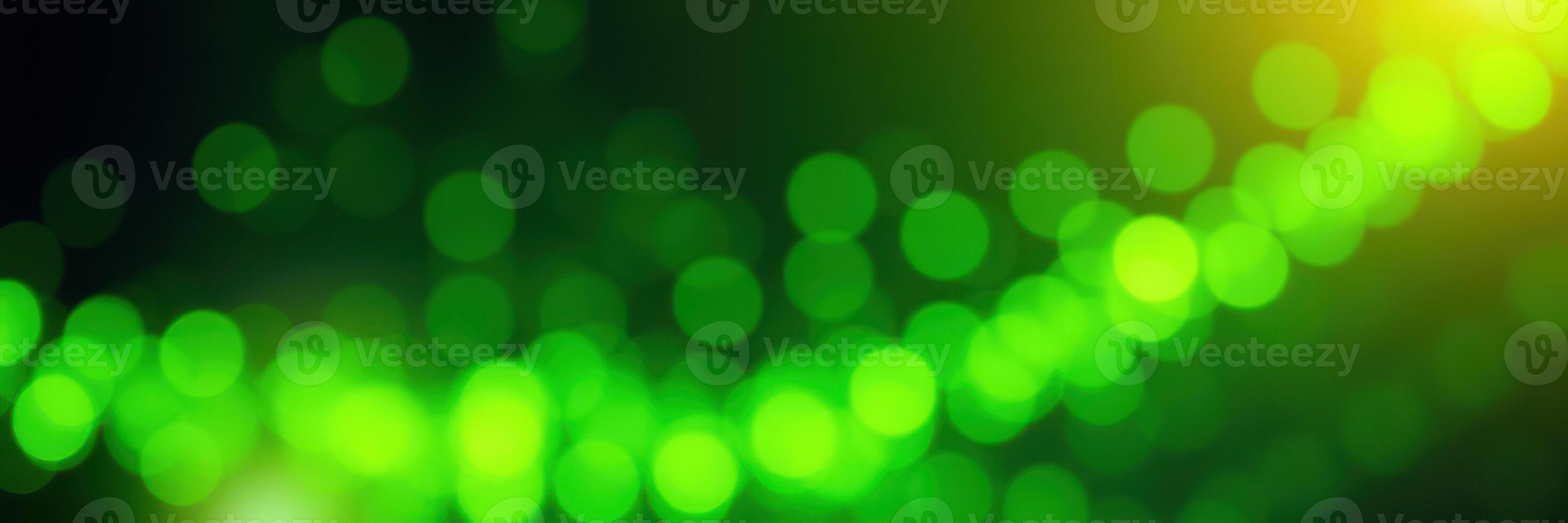 Vibrant green bokeh lights create a mesmerizing abstract background in a lively celebration atmosphere photo