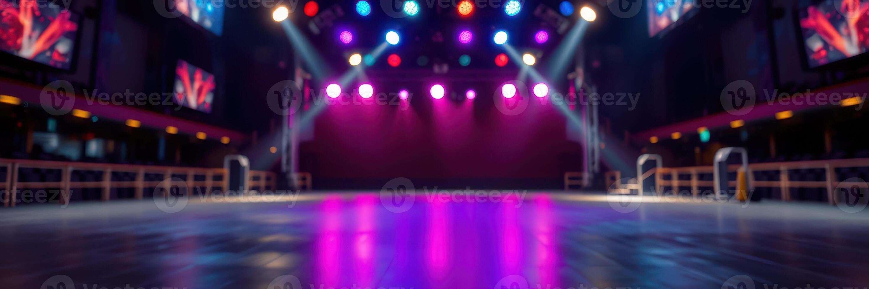 Dramatic lighting frames an empty dance floor in a vibrant nightclub setting during late evening hours photo