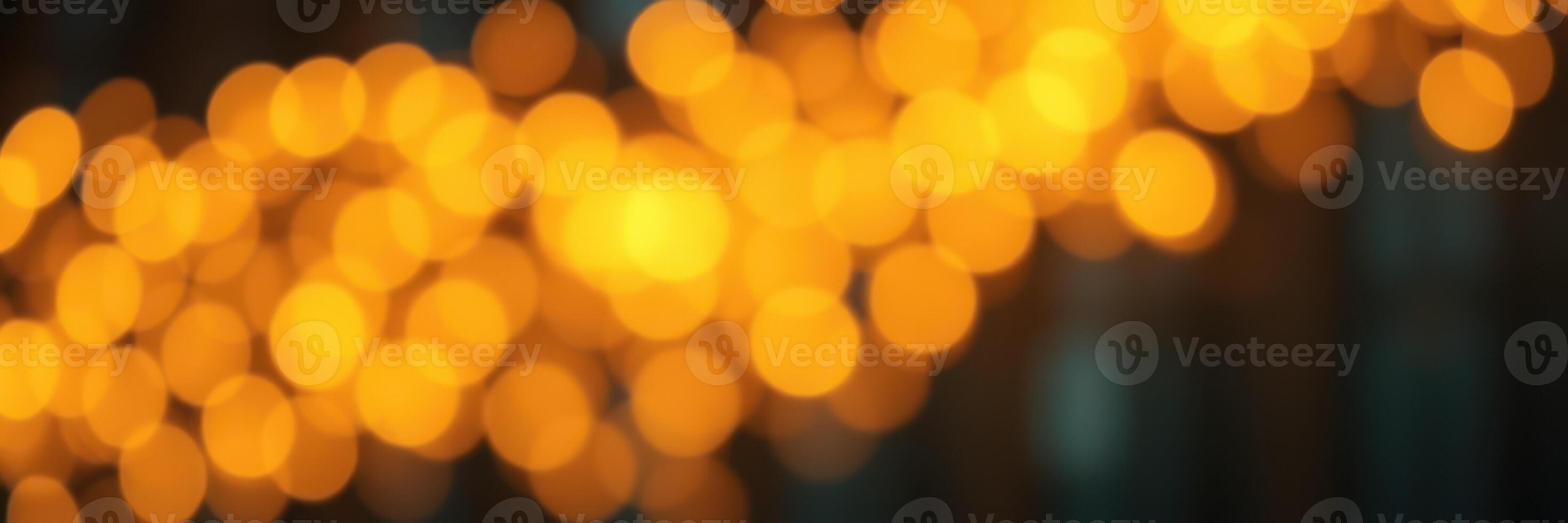 Warm, glowing bokeh lights create a festive ambiance in an evening celebration setting photo