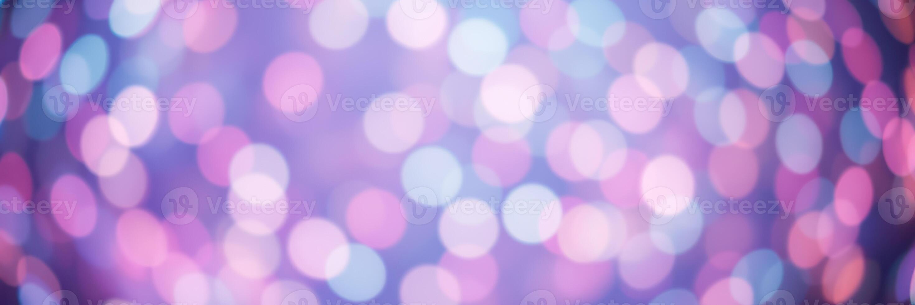 Soft, shimmering bokeh lights create a dreamy atmosphere in shades of pink and blue photo