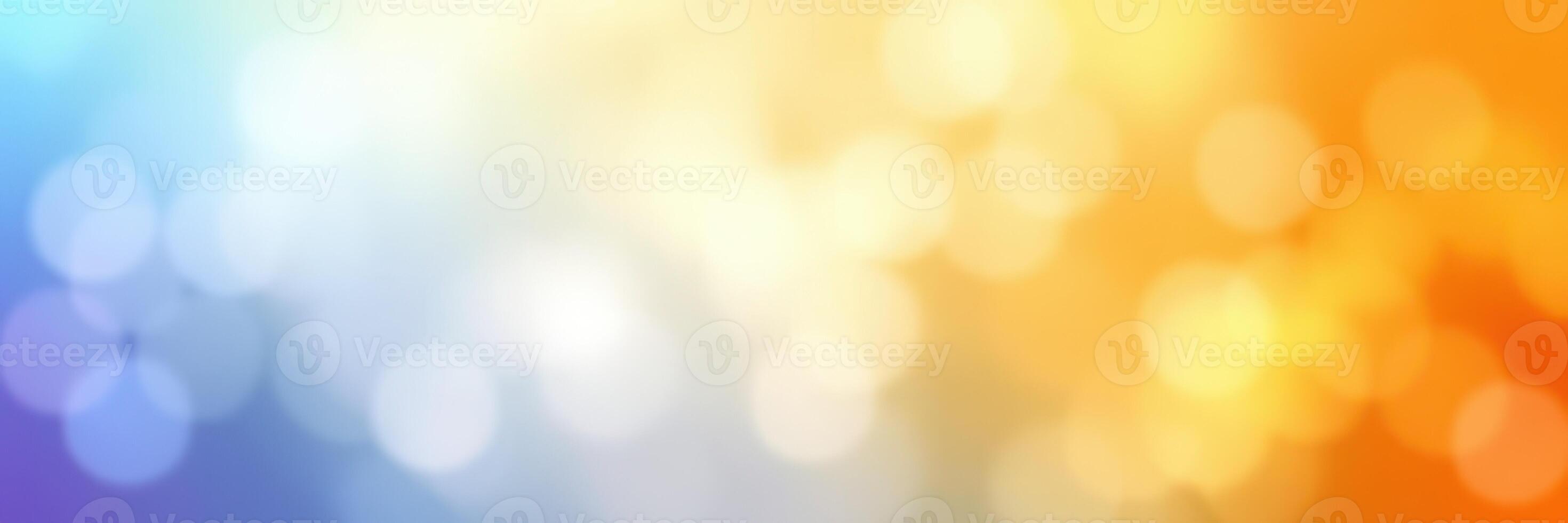 Vibrant bokeh background featuring soft colors of blue, orange, and yellow for creative design and artistic projects photo