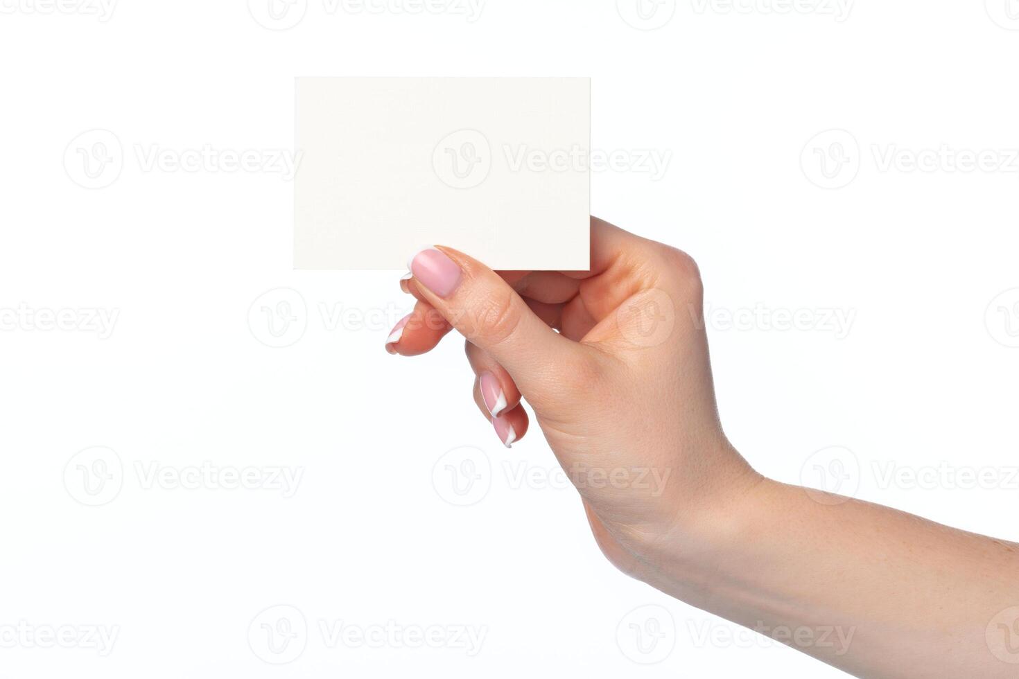 Female hand with blank white business card isolated on white photo