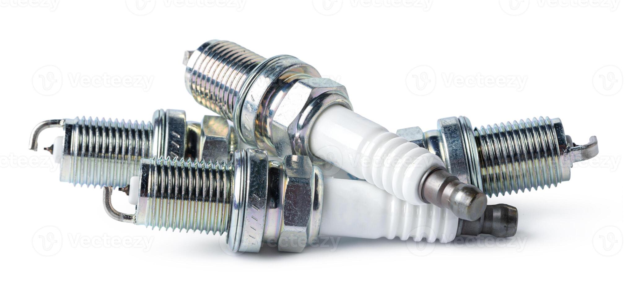 Car part. Spark plugs isolated on white. photo