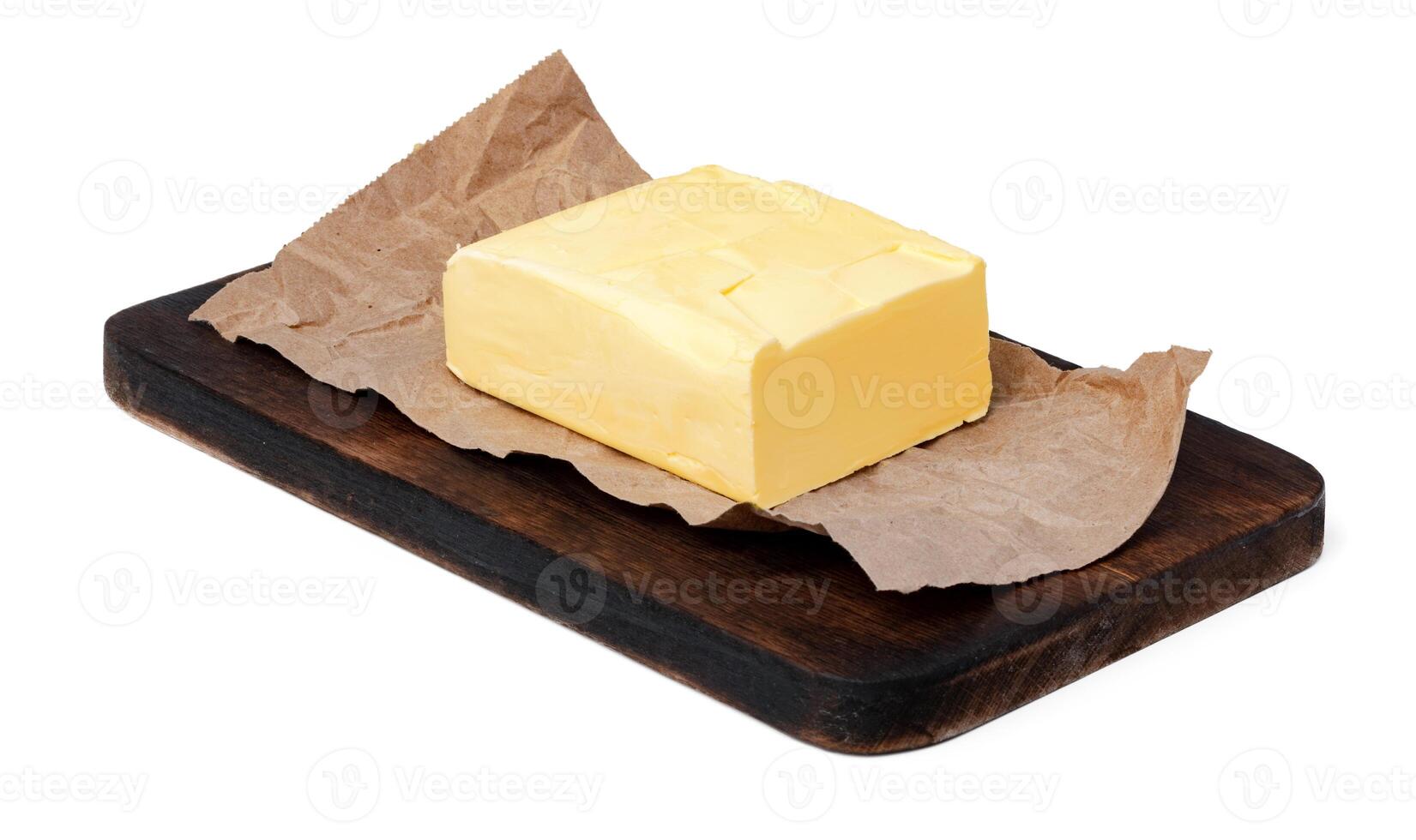Butter on wooden board isolated on white background photo
