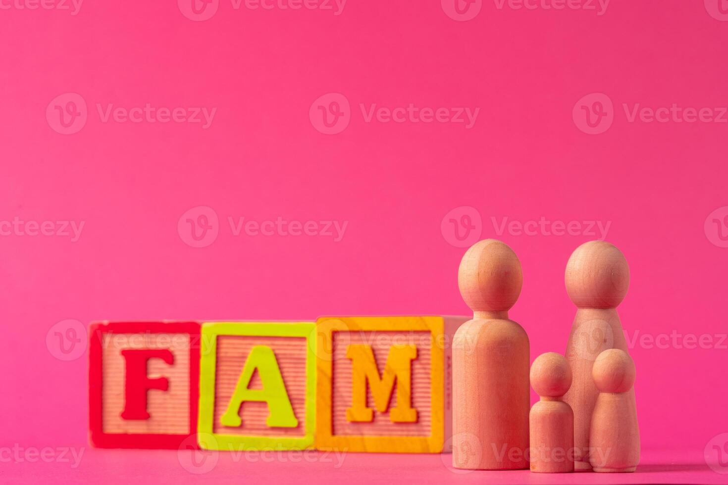 Small wooden figures of family members. Family relationship symbol photo