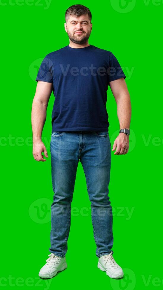 A man standing confidently against a bright green backdrop photo