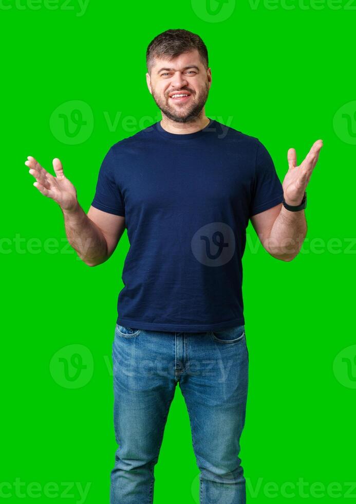 A surprised man expresses shock against a bright green background photo