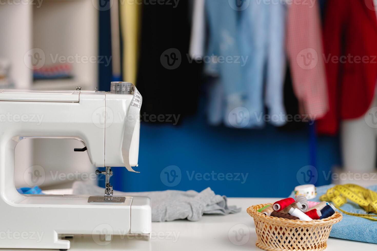 Electric sewing machine in a seamstress office photo