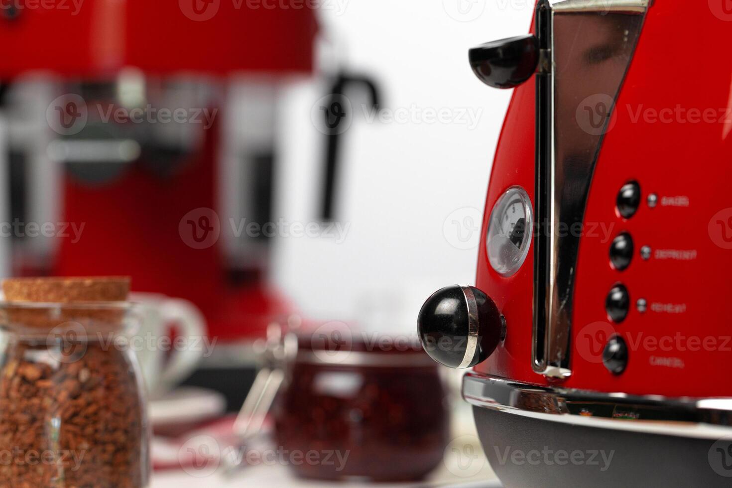 Close up of red kitchen .appliances on kitchen table photo