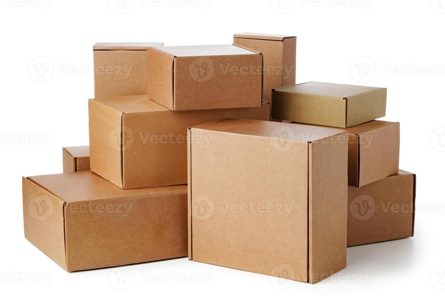 Stacked brown cardboard boxes in various sizes arranged on a white background photo