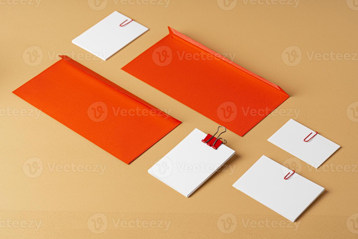 Red and white blank branding paper on beige background photo