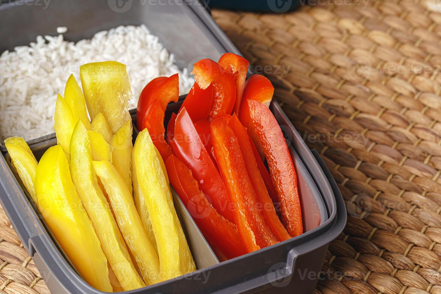 Cut pieces of yellow and red bell pepper photo