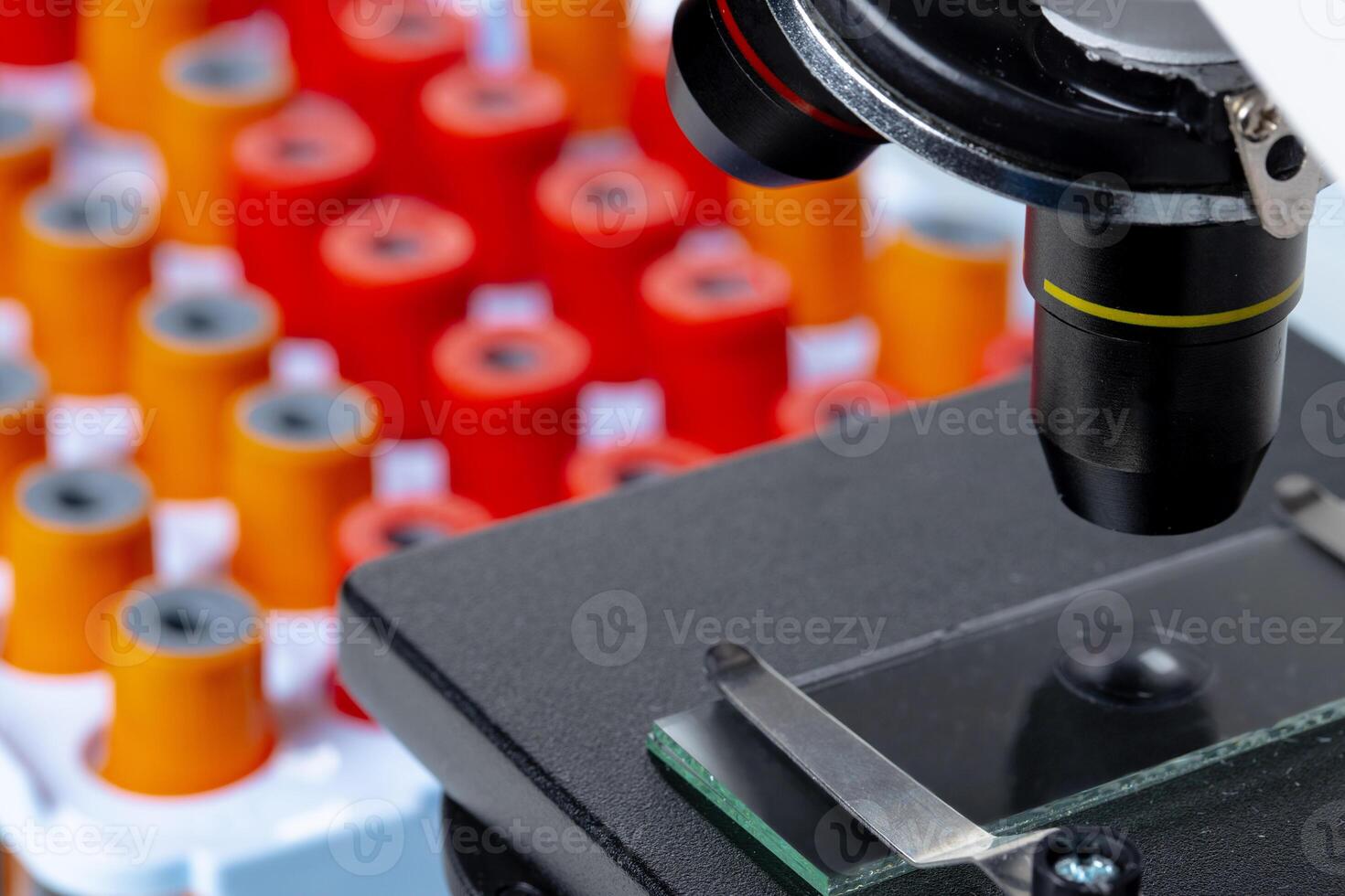 Microscope with blood samples test tubes close up photo