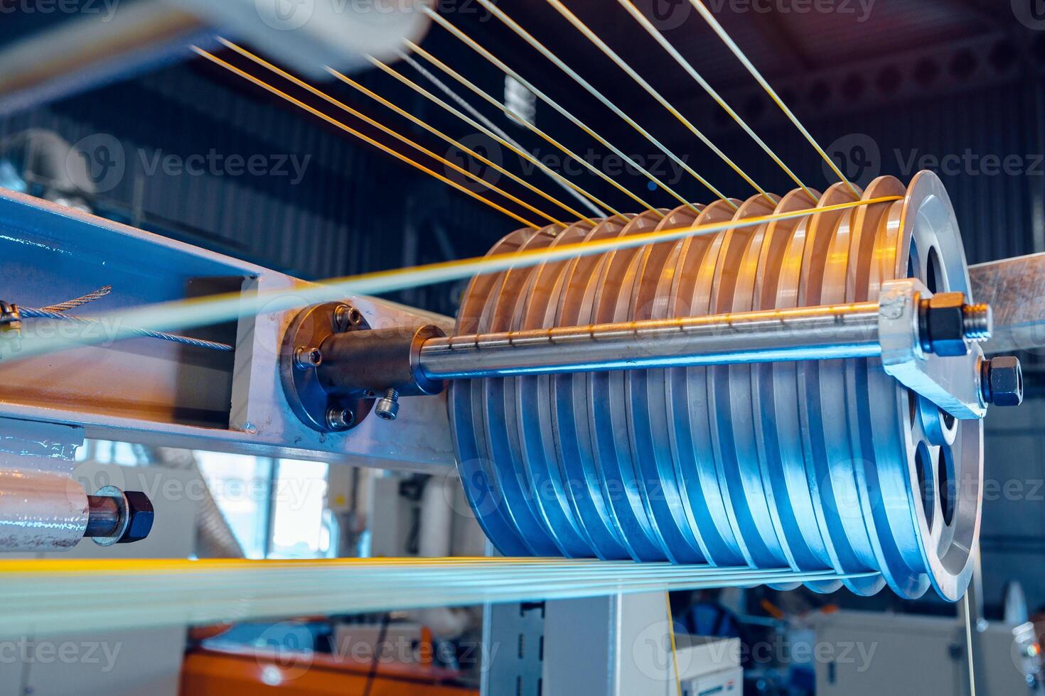 Inside a modern plant producing power electric cables and optical fibers. .Cable manufacturing machine part. photo