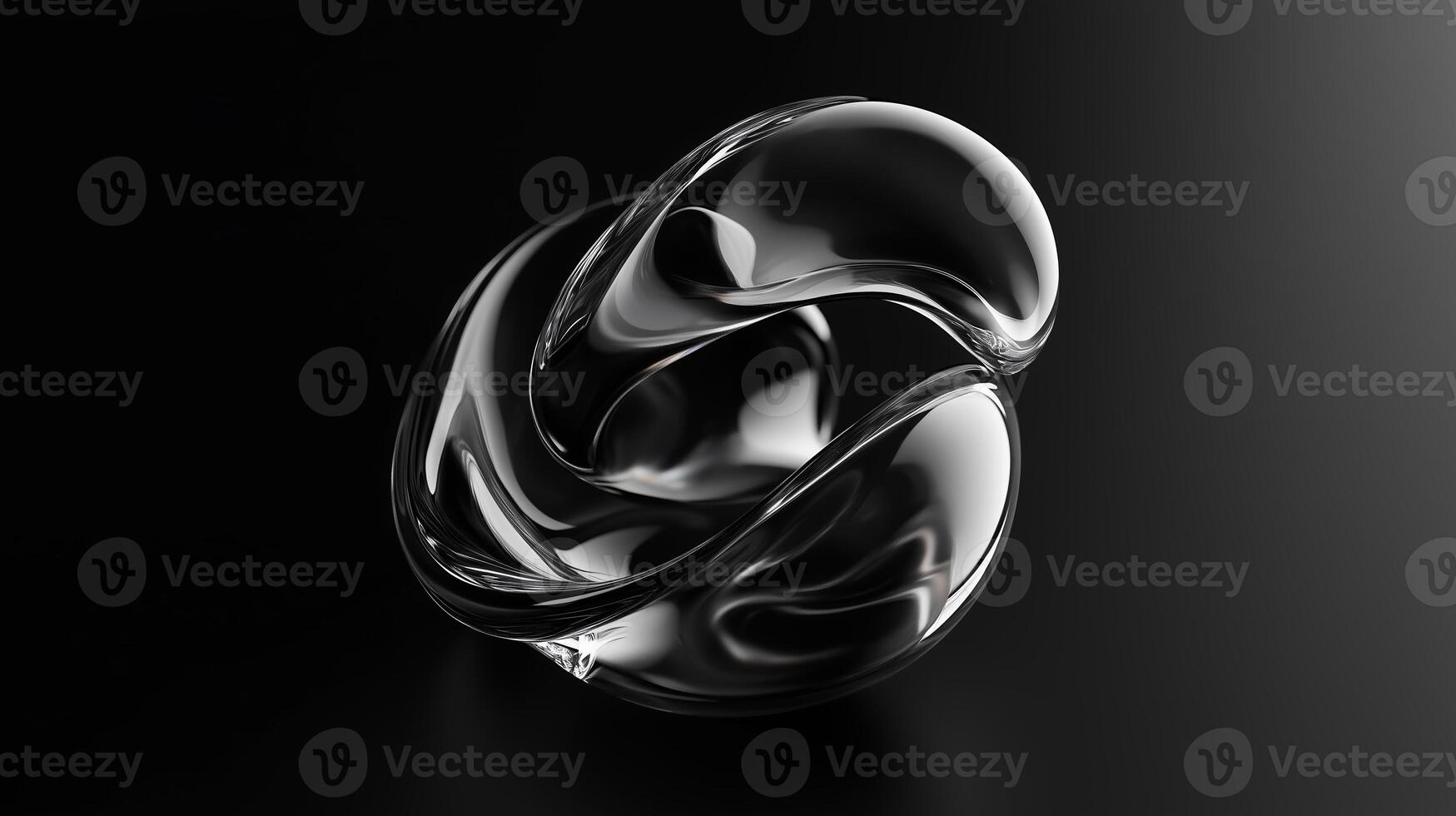 Abstract glass sculpture reflecting light on a dark background in an artistic display of form and texture photo