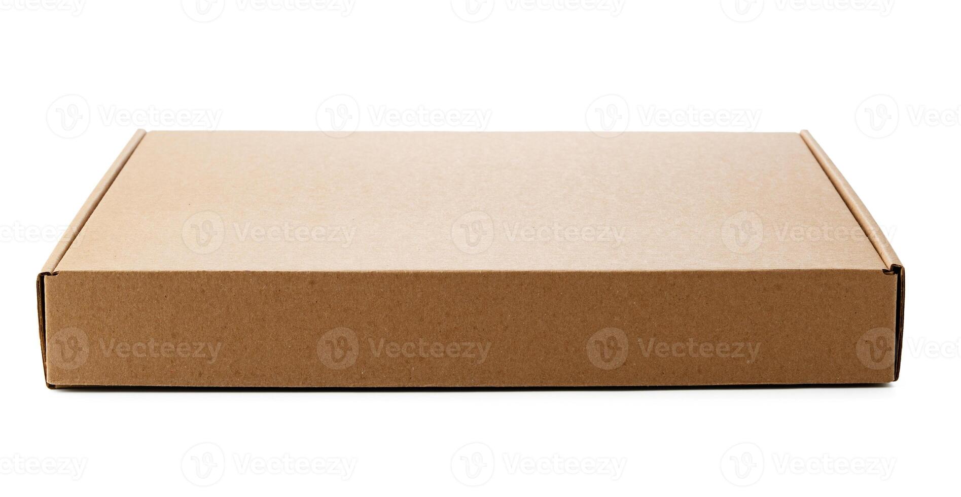 A plain cardboard box resting on a flat surface ready for shipping photo