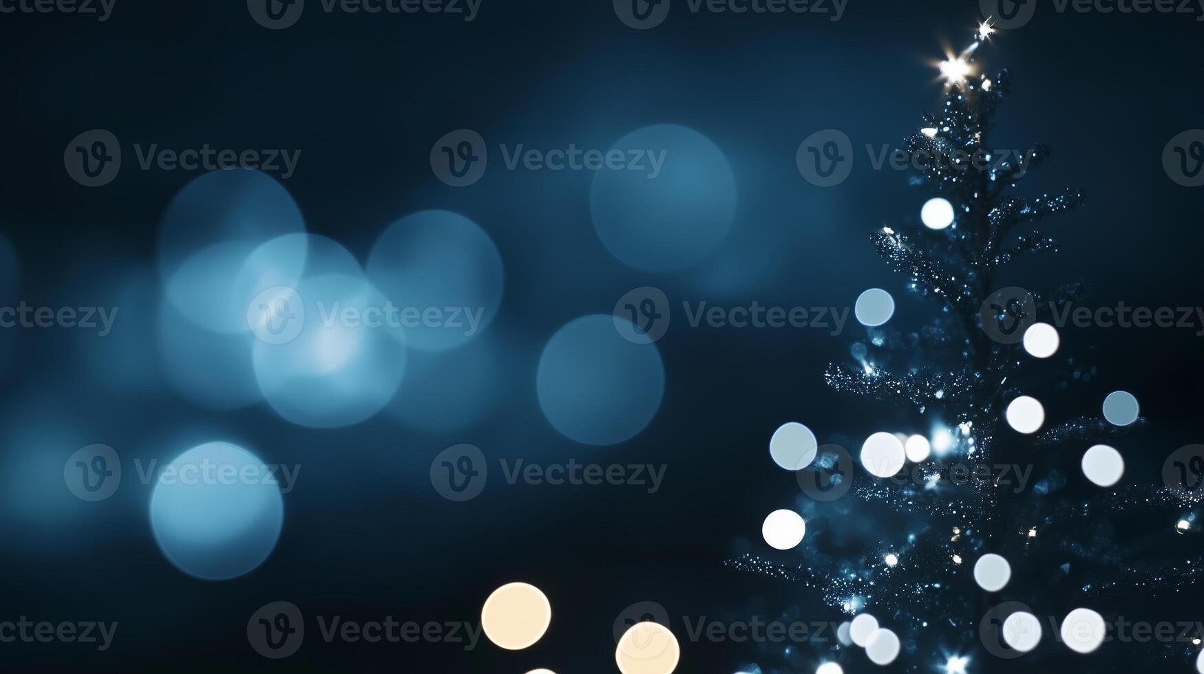 Brightly lit Christmas tree with sparkling decorations and soft blue bokeh background during the holiday season photo