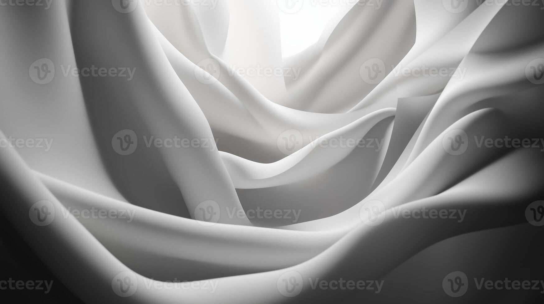 Soft white fabric flowing gracefully in gentle waves under bright light creating an elegant texture photo