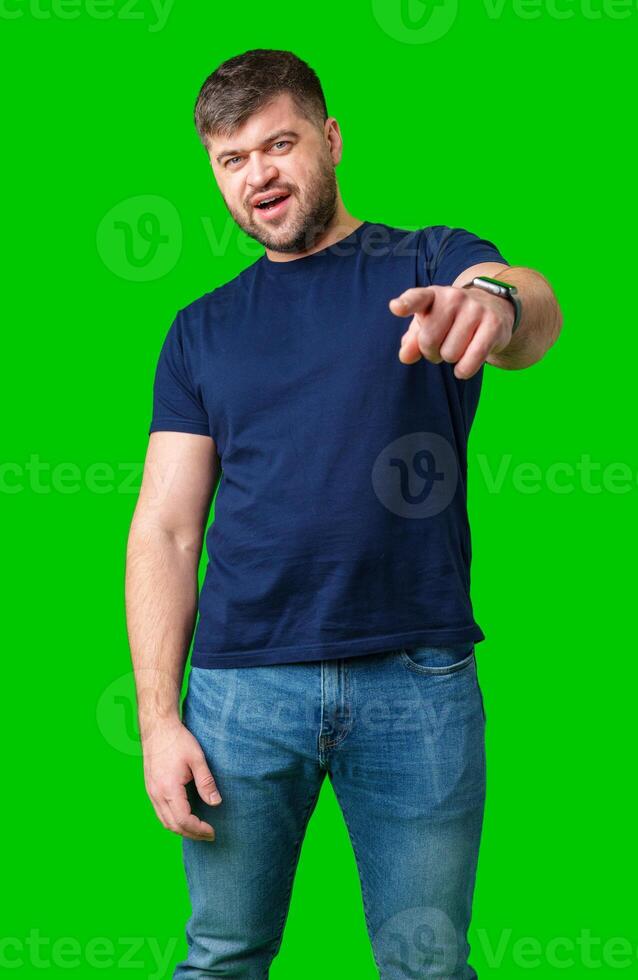 camera while posing in front of a bright green backdrop photo