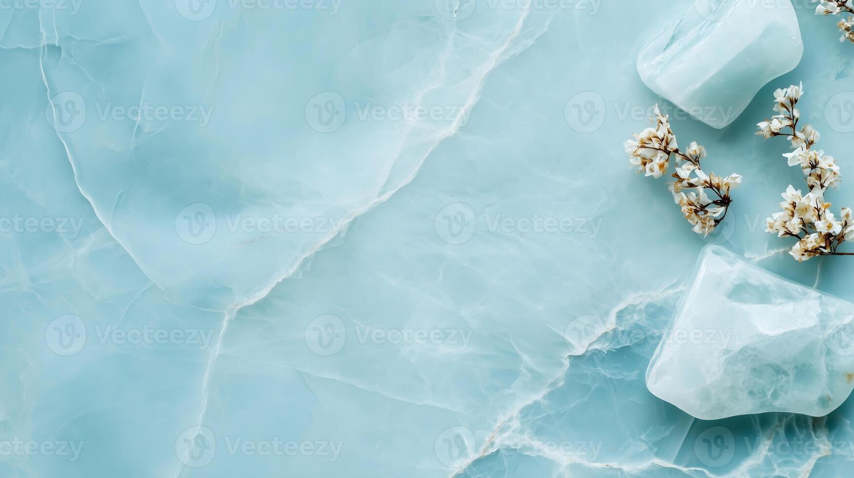 Serene blue background with ice cubes and dried flowers creating a calming aesthetic for natural beauty inspiration photo