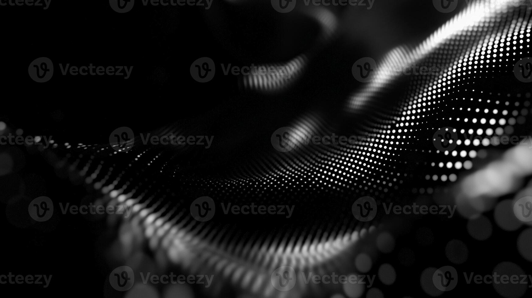 Smoothly flowing black fabric with shimmering dots creates a captivating abstract pattern and texture photo